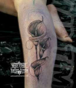black and gray flowers tattoo