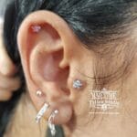 36Professional Piercing Liverpool home new ognialna zagubiona 36 kafelkow rofessional tragus piercing showcase at Mad Time Tattoo Studio, featuring a marquise-cut crystal stud on the tragus cartilage, paired with a titanium daith hoop ring and an upper flat cartilage stud on a female client.