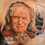 Home new Highly detailed color realism portrait tattoo of Pope John Paul II with realistic facial features and white hair, inked on an arm by Mad Time Tattoo.