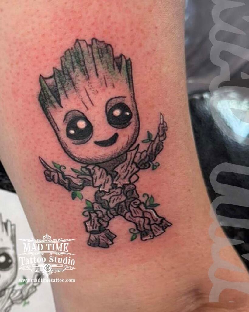 Cute dotwork and blackwork tattoo of Baby Groot from Guardians of the Galaxy on a forearm.