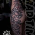 Home new Massive black and grey ornamental tattoo covering a woman's entire side from the bra line down the ribs, hip, and outer thigh.