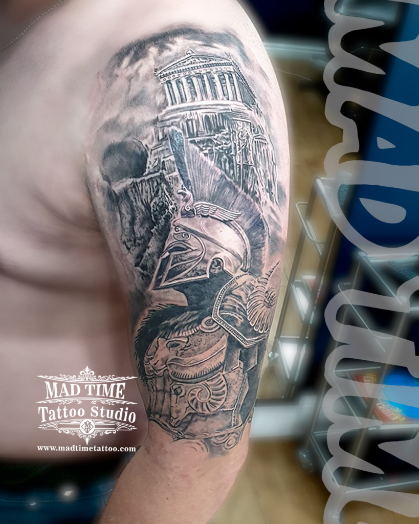 Detailed Greek realism sleeve tattoo featuring a Spartan warrior profile in an ornate helmet beneath the Parthenon temple by Henry at our studio