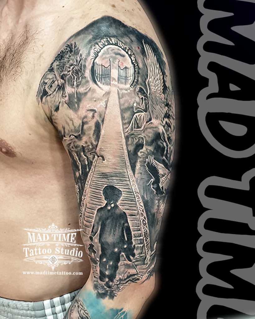 Surreal black and grey realism half sleeve depicting a boy walking up the stairway to heaven gates flanked by a crying angel by Henry at our studio