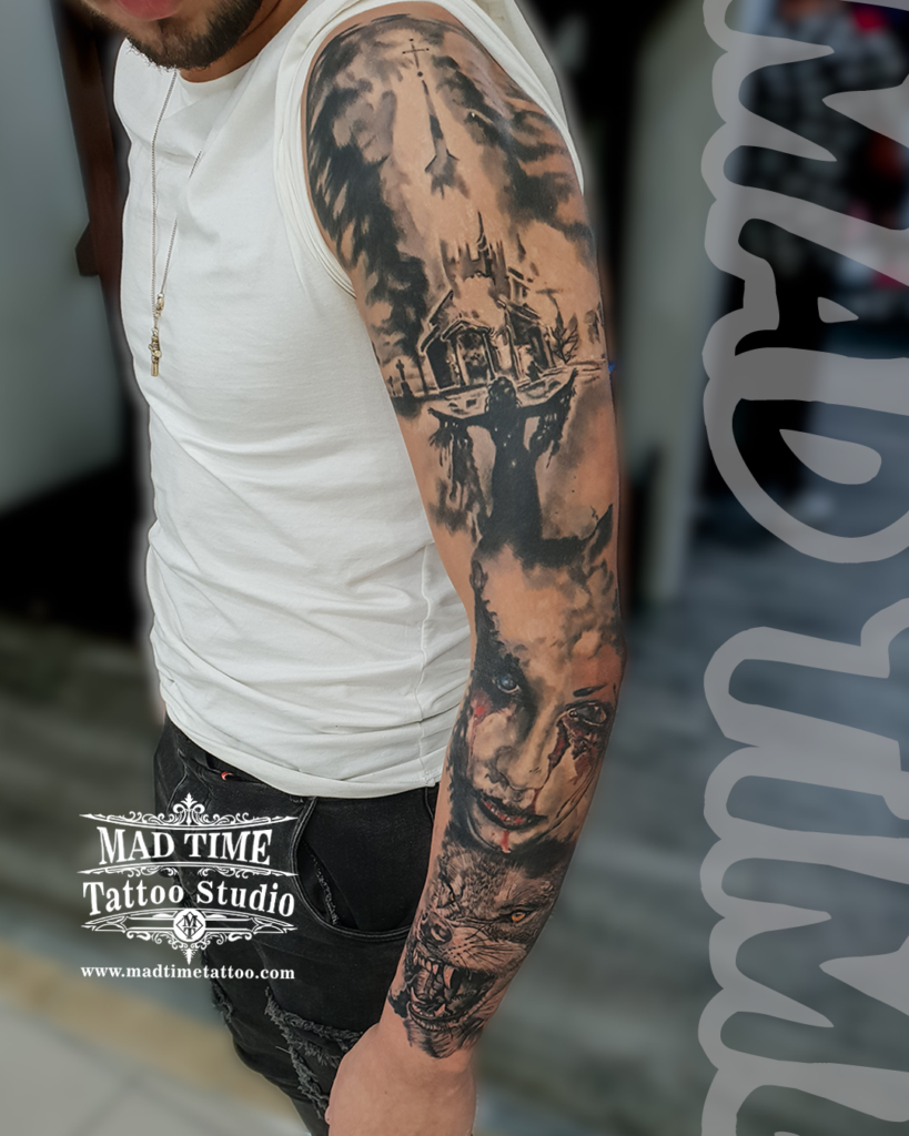 Complete black and grey realism sleeve tattoo featuring a church in flames a dark silhouette a bleeding demonic woman's face and a snarling wolf by Henry at our studio