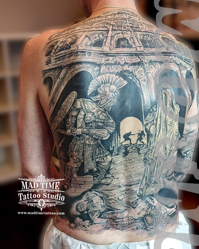 Masterpiece full back black and grey realism tattoo of a Roman gladiator in an arena under the Colosseum arches by Henry at our studio