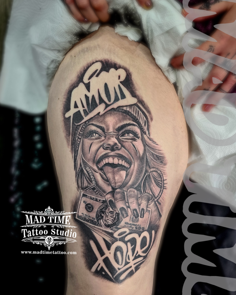 Chicano style realism thigh tattoo of a smiling girl with a beanie holding a 100 dollar bill with Amor and Hope script by Henry at our studio