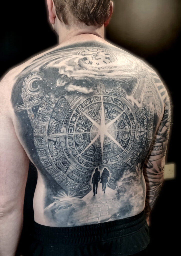 • Monumental full back black and grey tattoo featuring a detailed Aztec calendar clock face and a walking couple by guest artist Pablo from Spain at our studio