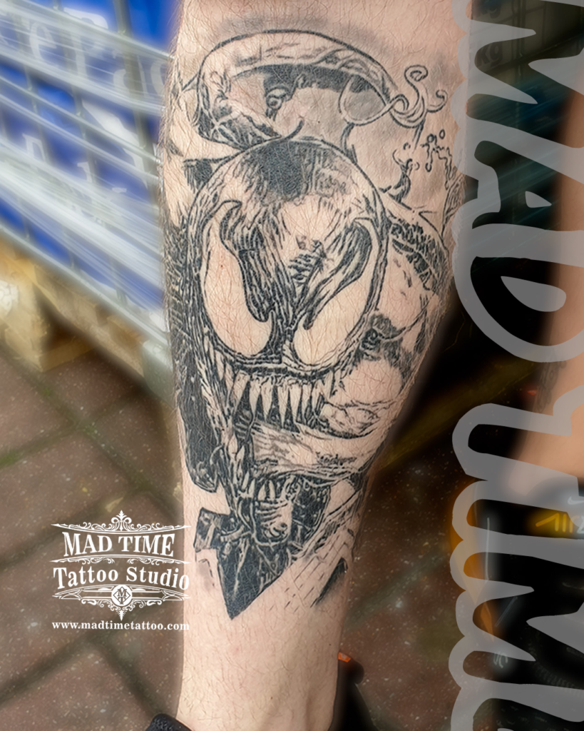 Marvel comics Venom leg tattoo featuring a raw scratched sketch linework style with sharp teeth and long tongue by our studio