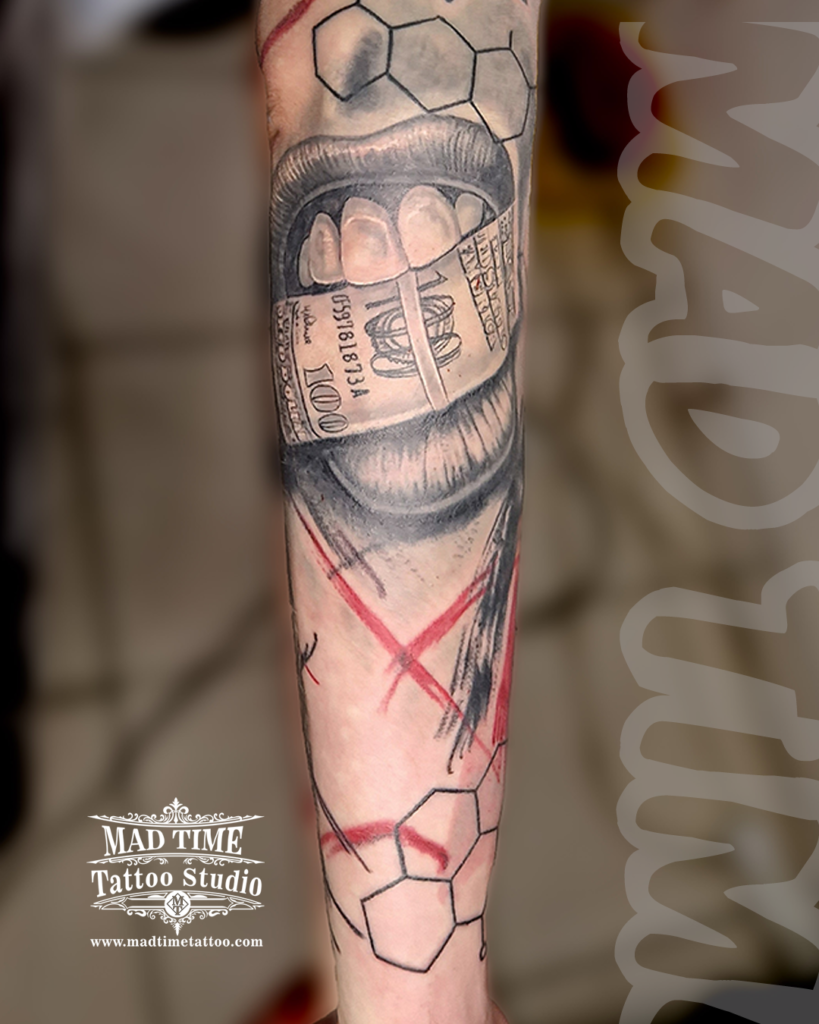 Trash Polka forearm tattoo depicting a realistic mouth biting down on a 100 dollar bill paired with fine line chemical molecular grids and red scratches by our studio